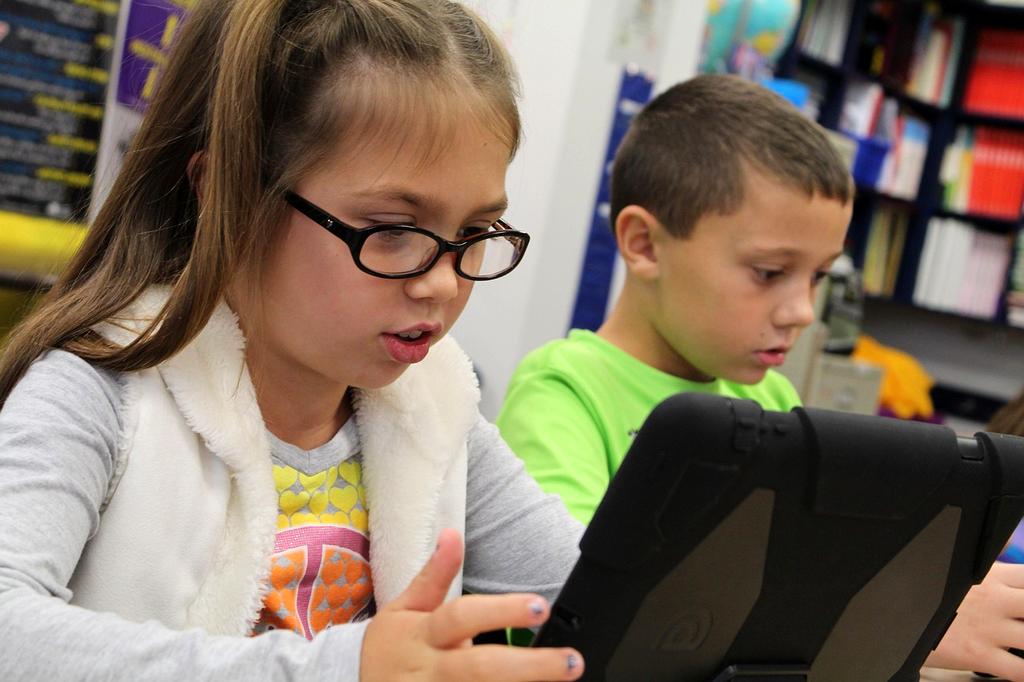 Group of diverse students collaborating in a modern computer lab