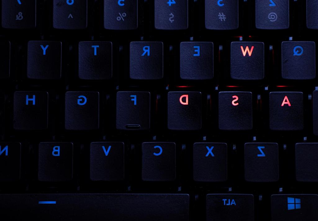 Modern computer technology workspace with multiple screens and advanced hardware